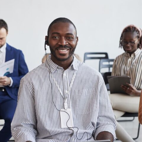 smiling-african-american-businessman-in-audience-2023-11-27-05-22-33-utc_Medium