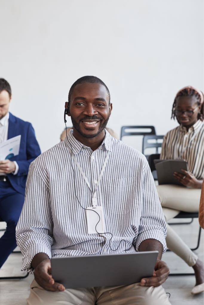 smiling-african-american-businessman-in-audience-2023-11-27-05-22-33-utc_Medium