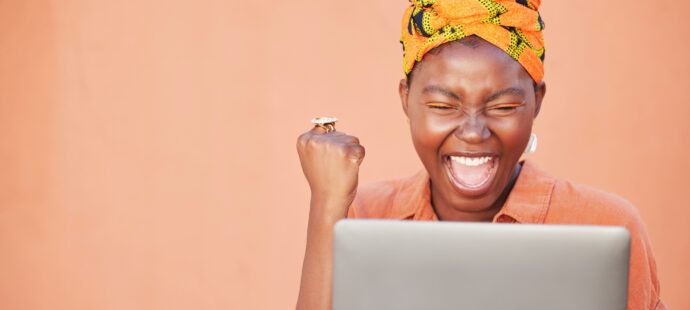 success-celebration-and-black-woman-on-laptop-aft-2023-11-27-04-53-07-utc_High